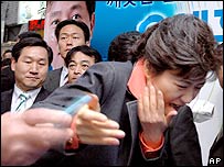 Park Geun-hye, chairwoman of the Grand National Party, is attacked by an assailant with a box cutter during a campaign for the upcoming local elections in Seoul, Saturday, May 20, 2006