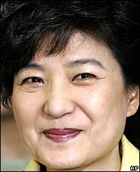 Park Geun-hye, chairwoman of the main opposition Grand National Party, smiles while she watches a live televised newscast, reporting election update at the party's headquarter in Seoul, May 31, 2006.